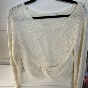 cream sweater with twist in front
